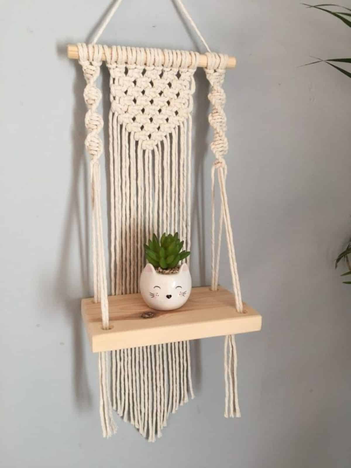 Mini Macrame Shelf with a cute cat pot with a succulent.